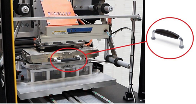 Handles provide heat insulation in demanding printing machine application