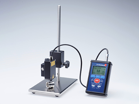 Hand-held test instrument for metal cleanliness