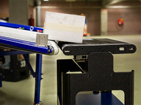 Robots versus conveyors: A showdown in warehouse logistics