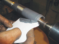 How do you re-use worn cylindrical parts with adhesives?