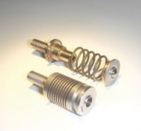 Machined spring assimilates separate parts in one piece