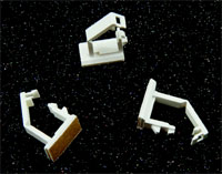 Adhesive based releasable wire clip