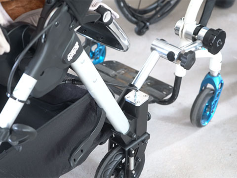 Accessible pushchair for wheelchair users designed using self-lubricated plain bearings